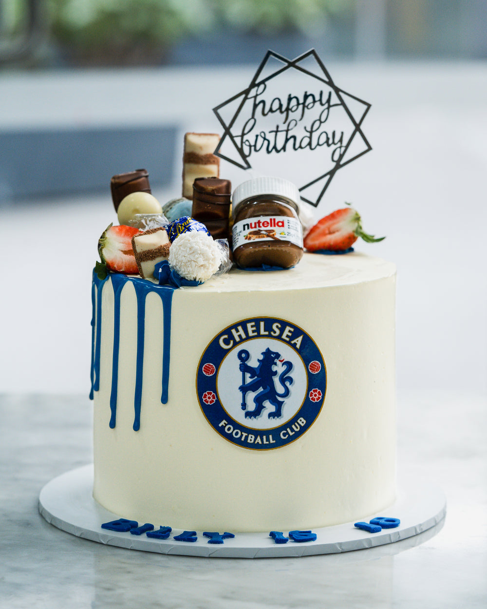 45 Awesome Football Birthday Cake Ideas : Blue and White Chelsea Cake +  Gold Flakes